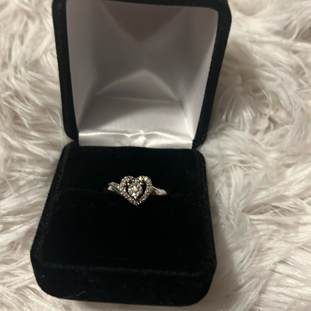 Silver & clear stone heart ring .